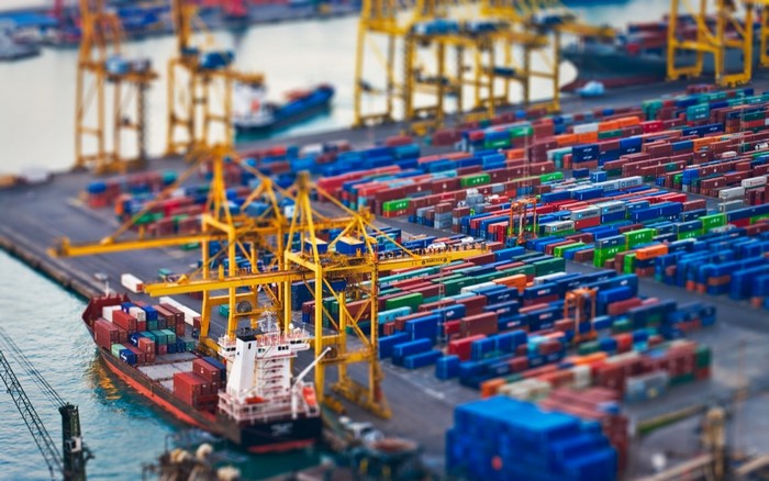 Container ship and cranes at a busy port