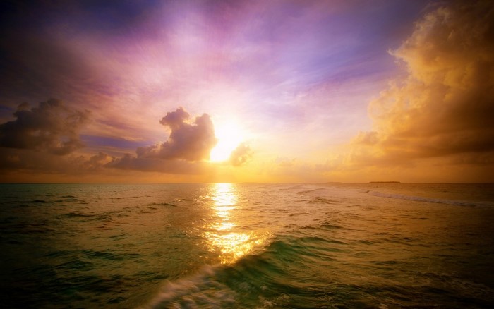 Serene Sunset Over Calm Sea with Colorful Sky