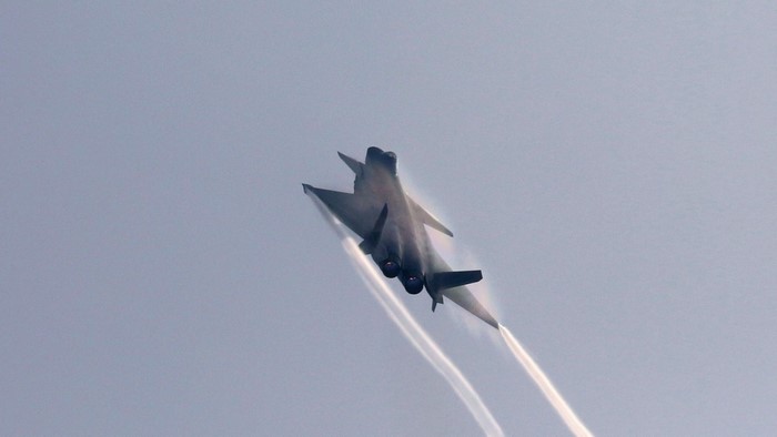 Chengdu J-20 fighter jet performing aerobatics