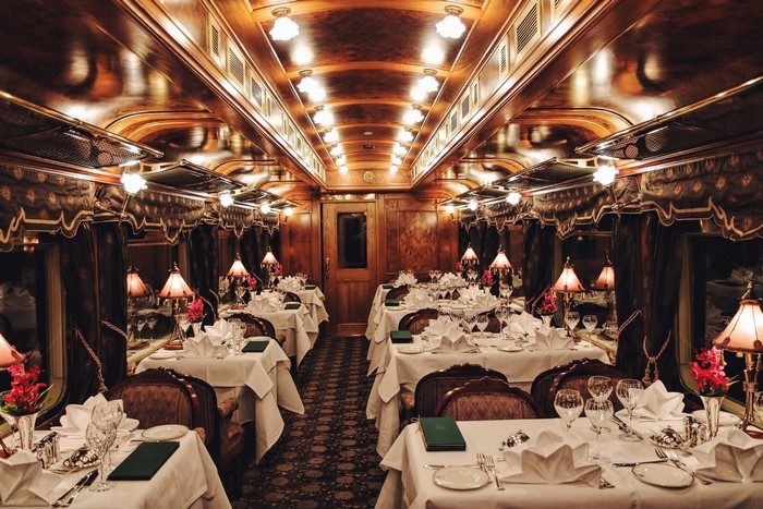 Elegant dining car interior with set tables