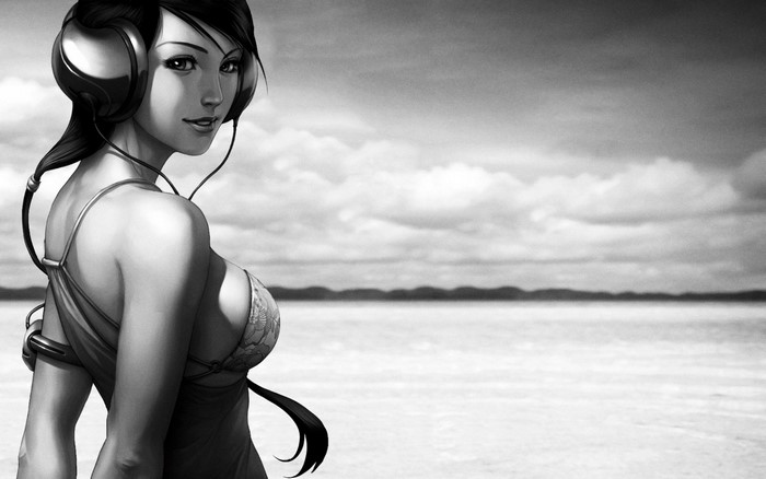 Woman with headphones on a beach