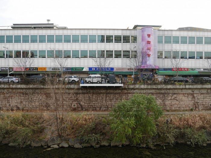 Cheonggyecheon Stream with Buildings and Cars in Seoul