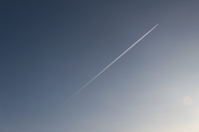 Airplane contrail in a clear blue sky