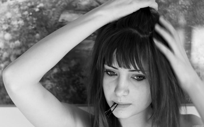 Susan Coffey with bobby pins in her mouth