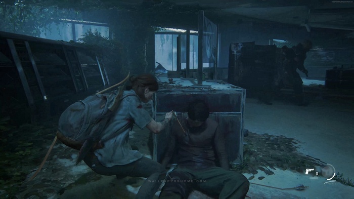 Ellie from The Last of Us: Part II tending to an injured person