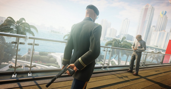 Agent 47 from Hitman 2 holding a pistol
