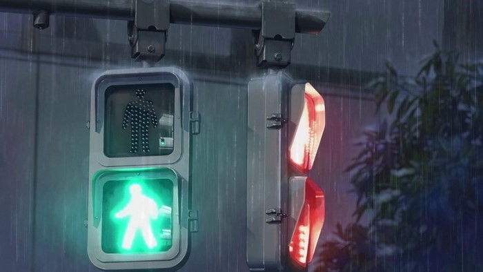 Pedestrian traffic light showing green man, vehicle traffic light showing red