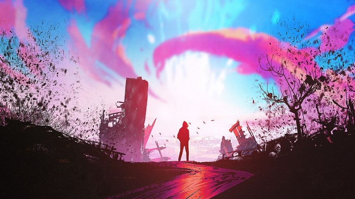 Person standing in ruined city with colorful sky