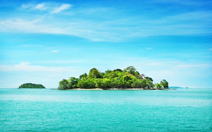 Tropical islands in the turquoise ocean under a blue sky