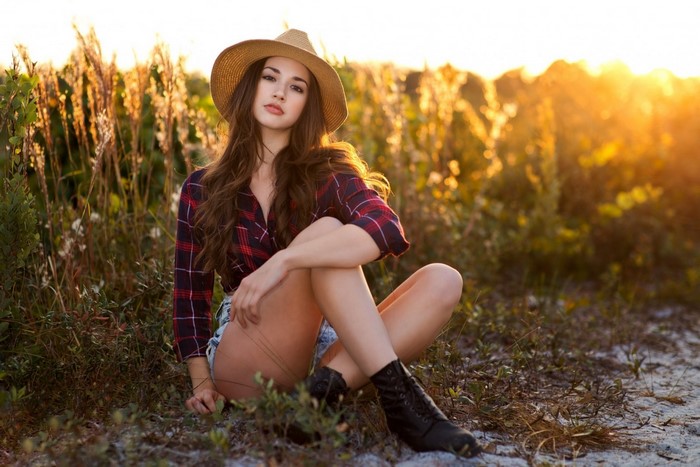 Woman Sitting in Nature at Sunset