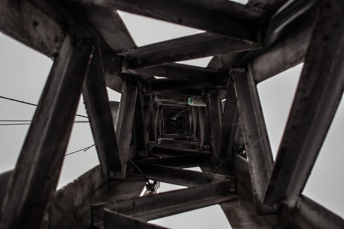 Looking up through a metal tower structure