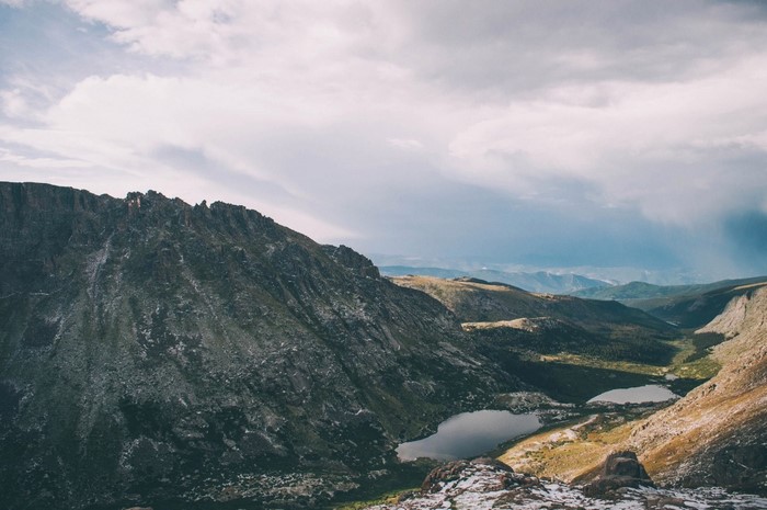 Mountain valley with lakes and dramatic clouds