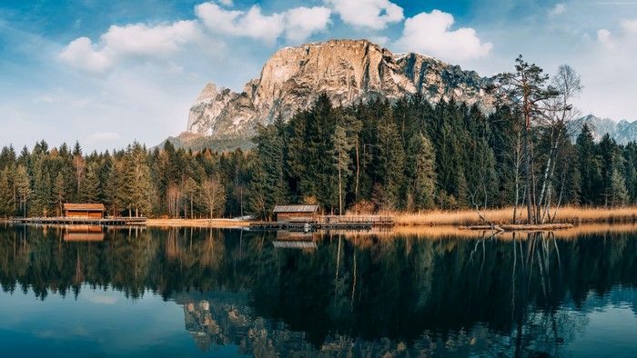 Lake with forest and mountains in autumn