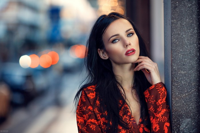 Woman with black hair and red dress