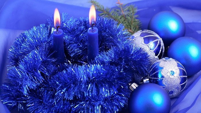 Blue Christmas decorations with lit candles