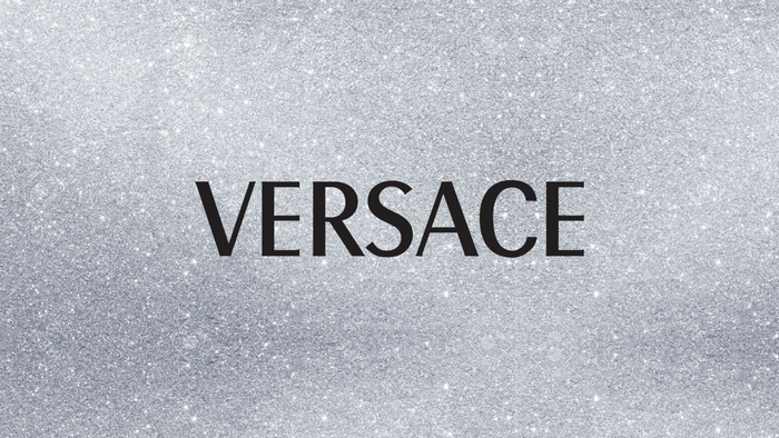 Versace logo on a glitter background