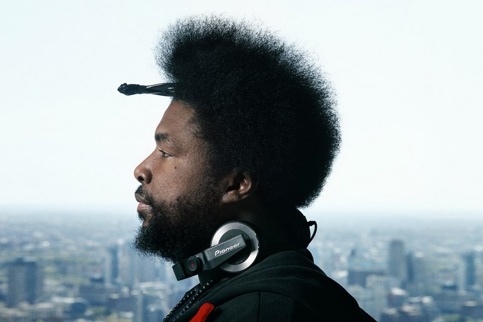 Questlove with Pioneer headphones overlooking city