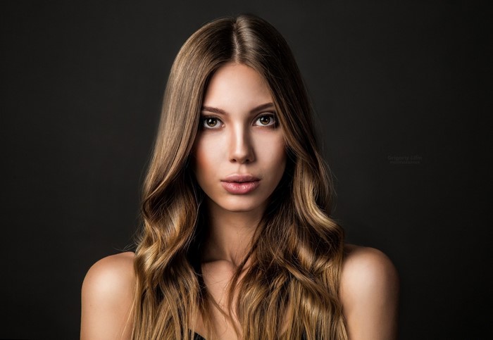 Portrait of a woman with long brown hair by Grigoriy Lifin