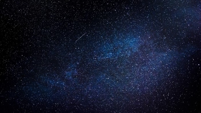 Starry night sky with a shooting star