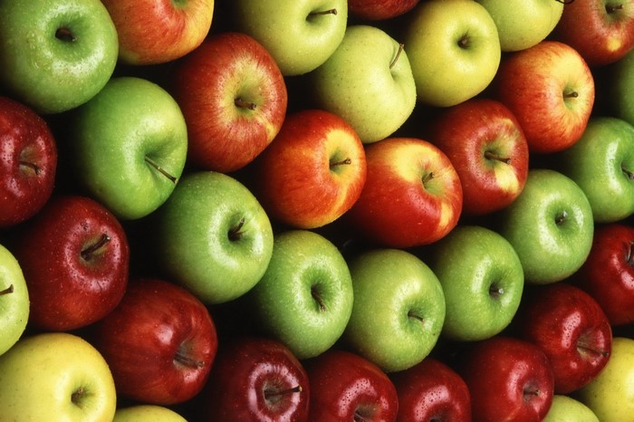 A colorful arrangement of red and green apples