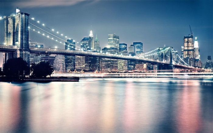 Brooklyn Bridge at night with New York City skyline