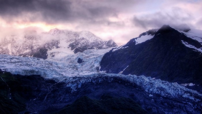 Glacier on a mountain range at dawn