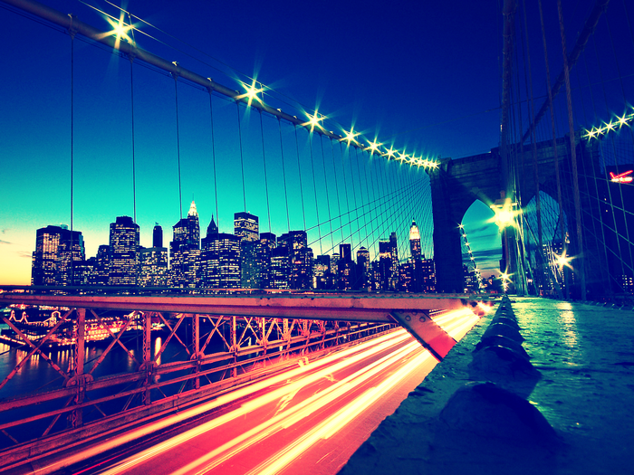 New York City skyline and Brooklyn Bridge at night
