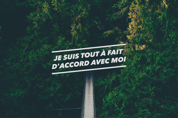 Sign with French quote in a forest
