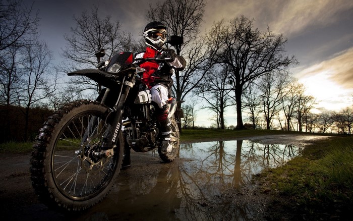 Man in motocross gear on a dirt bike