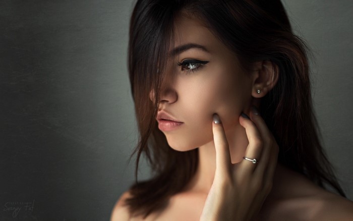 Woman with dark hair and eyeliner, portrait photography