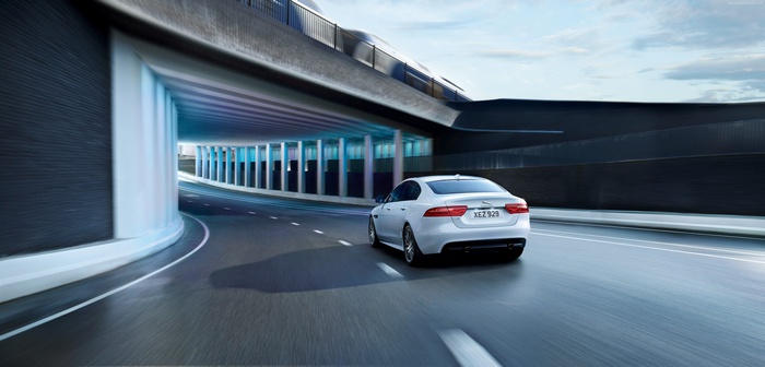 White Jaguar XE 300 Sport driving through tunnel