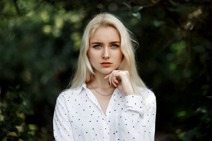 Blonde woman in polka dot shirt