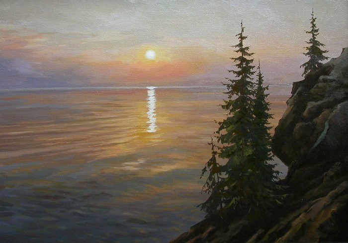 Sunset over the sea with rocky shore and pine trees