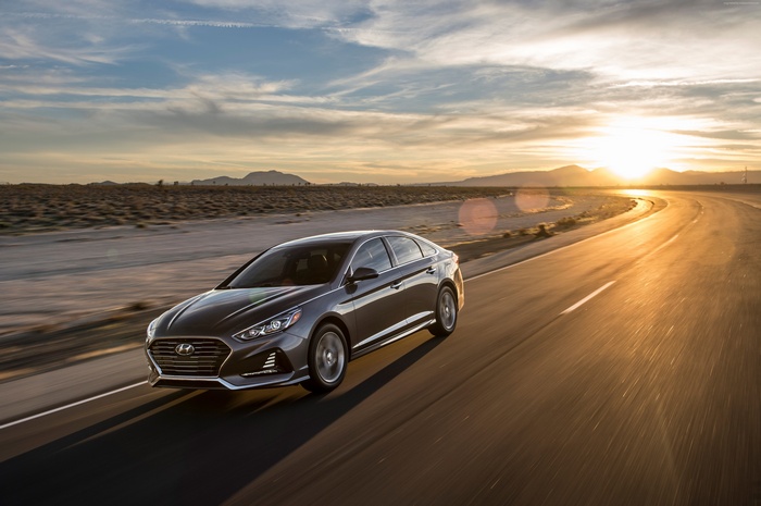 2018 Hyundai Sonata driving on a desert road at sunset