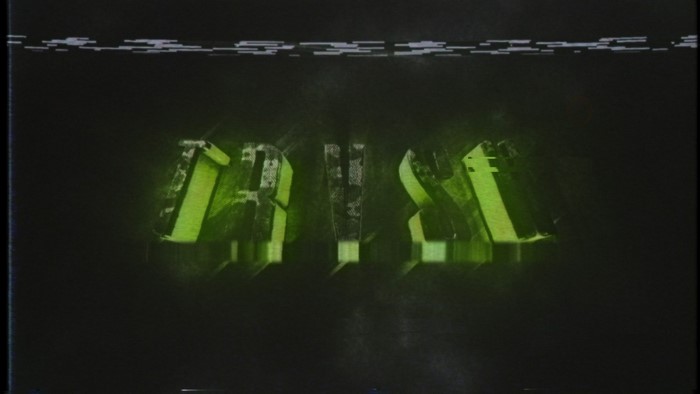Glitch art text with green glow and VHS effect