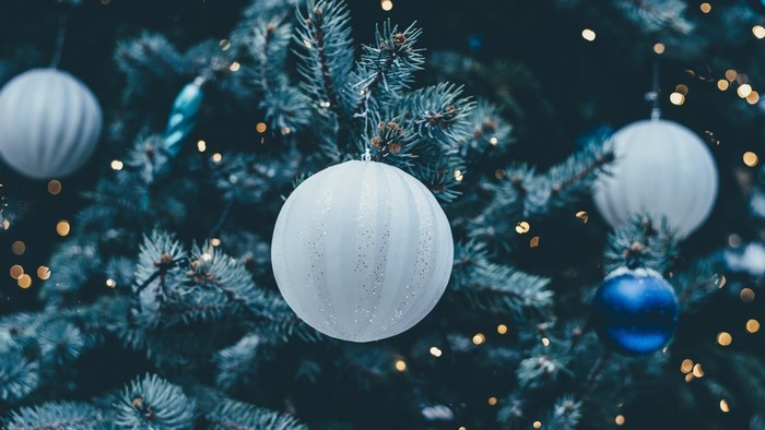 Christmas tree with blue and white ornaments and lights