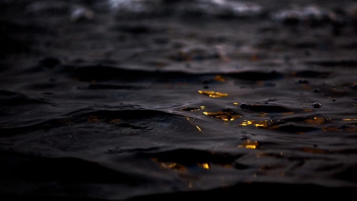 Dark water with reflections of light