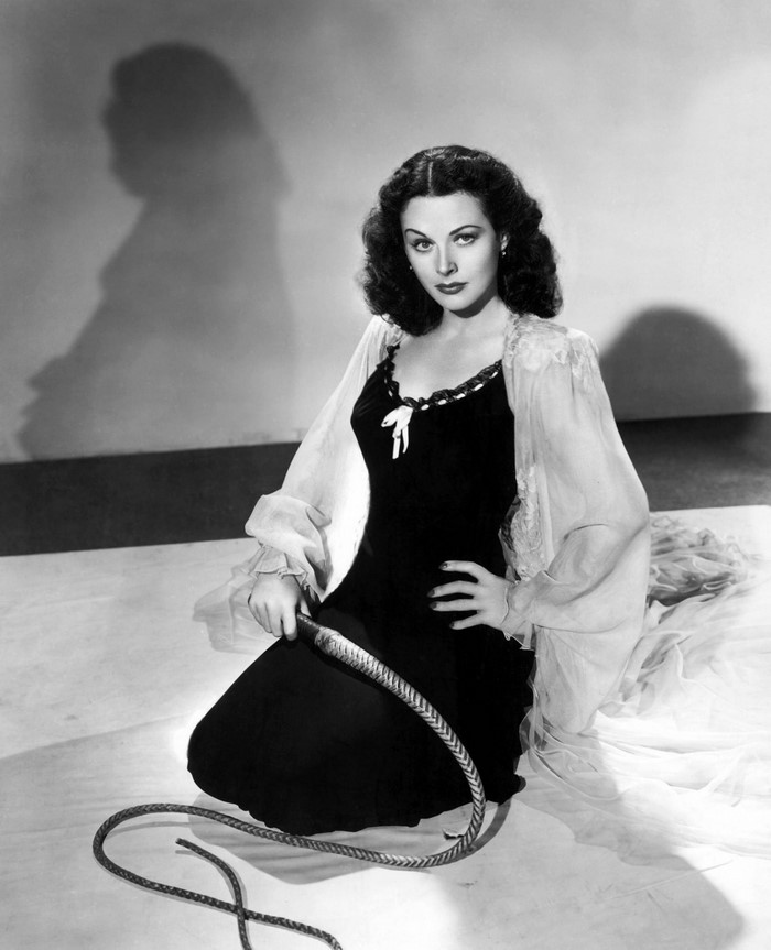 Hedy Lamarr holding a whip
