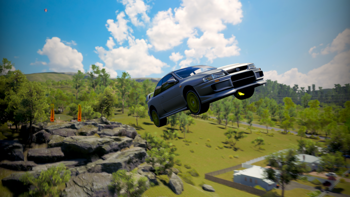 Subaru Impreza WRX STI flying over a landscape in Forza Horizon 3