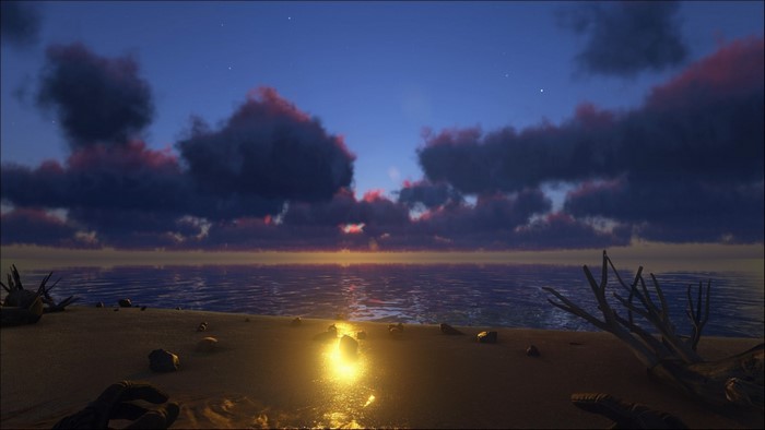 Sunset over the ocean with clouds and beach