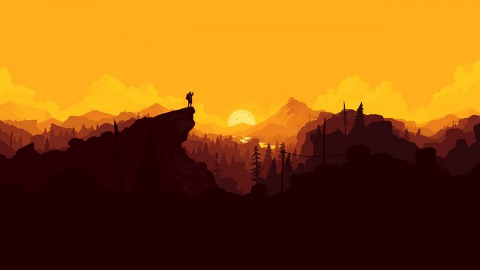 Silhouette of a hiker on a mountain at sunset
