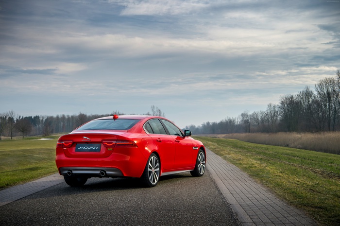 Red Jaguar XE 300 Sport parked on a road