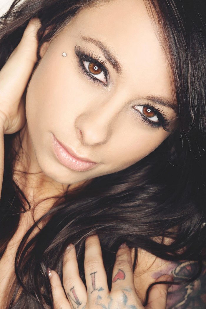 Woman with brown eyes and black hair, close up portrait