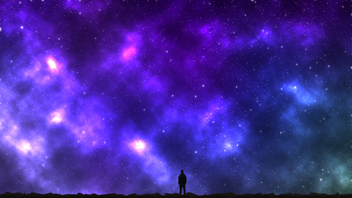 Silhouette of a man looking at a vibrant galaxy