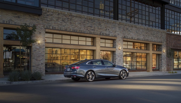 2019 Chevrolet Malibu Electric car parked outside a brick building