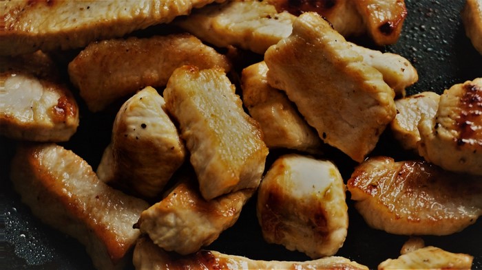 Close-up of pan-fried chicken pieces