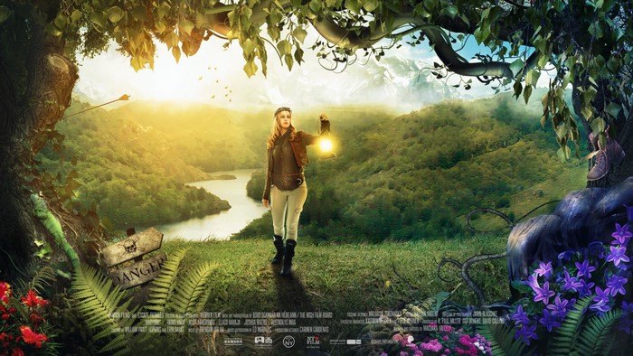 Woman with lantern in a magical forest