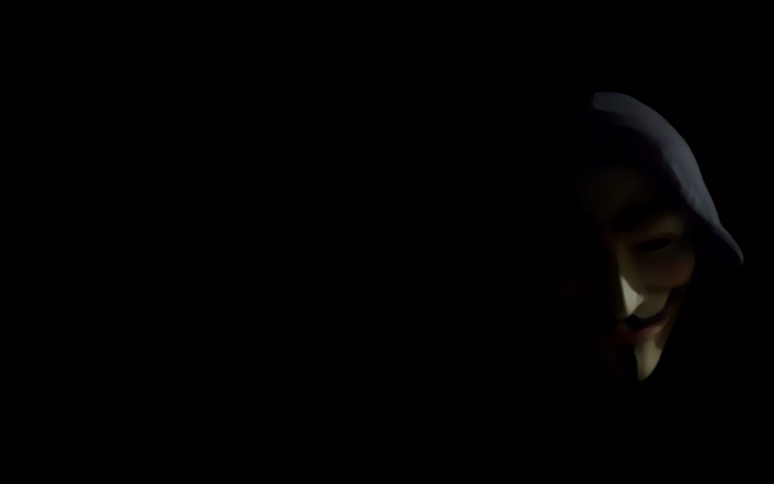 Guy Fawkes Mask in Dark Hooded Shadow