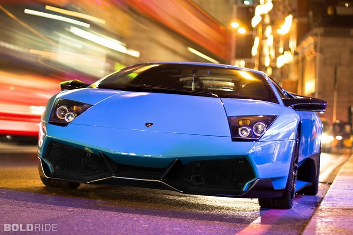 Blue Lamborghini Murcielago LP 670-4 SV on a city street at night