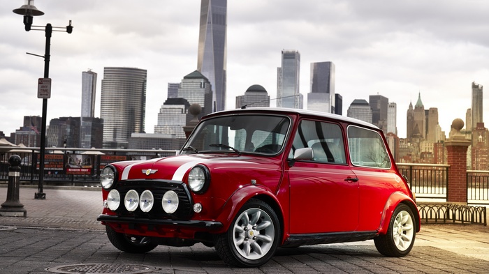 Red Mini Electric Concept car in front of New York City skyline